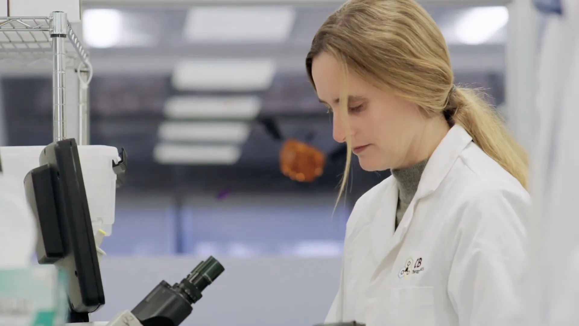 Erin Scott at the microscope.