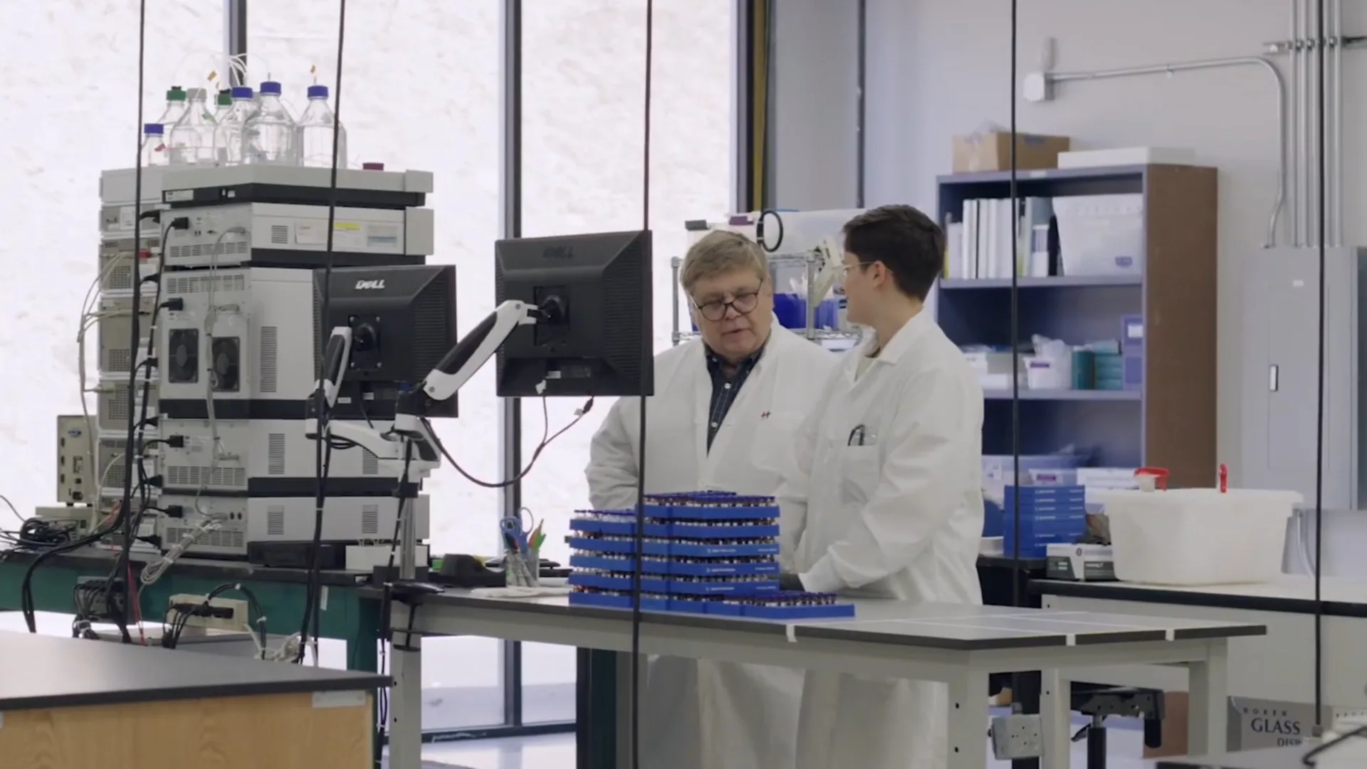 Two CBT scientists at the HPLC analytical workstation.
