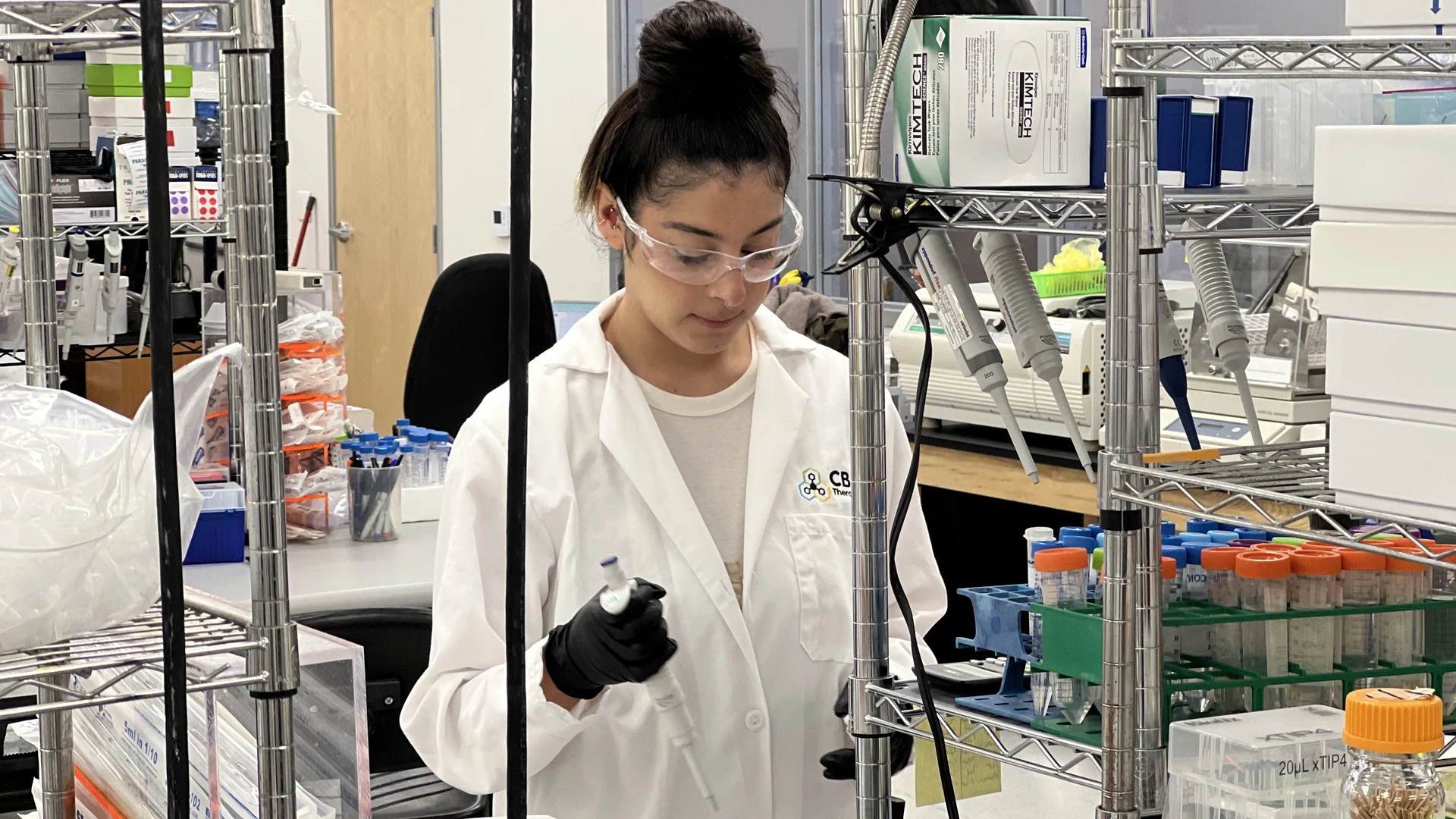 Scientist reviewing strain plates.
